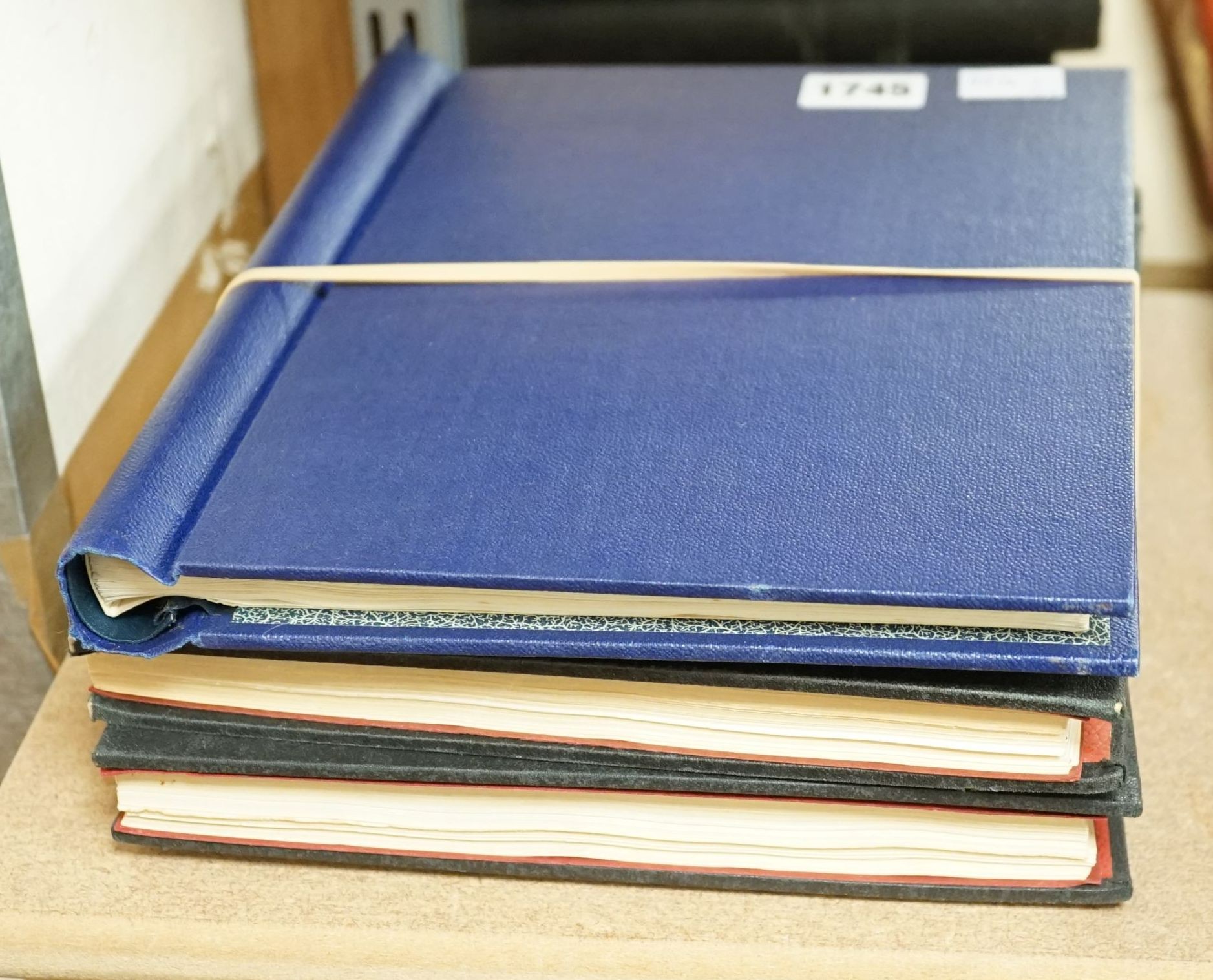 Three stamp albums with 1935 Silver Jubilee mint set of 250 including Egypt, 1937 Coronation two mint sets plus some used